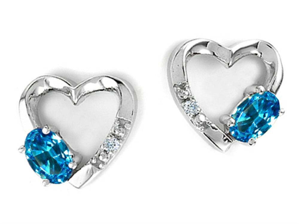 Tommaso Design™ Oval 5x3mm Genuine Blue Topaz Heart Earrings