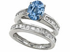 Star K™ 8x6mm Oval Simulated Aquamarine Wedding Set