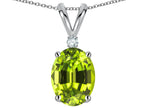 Star K Oval 8x6mm Genuine Peridot Rabbit Ear Pendant Necklace