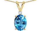 Star K Oval 8x6mm Genuine Blue Topaz Rabbit Ear Pendant Necklace