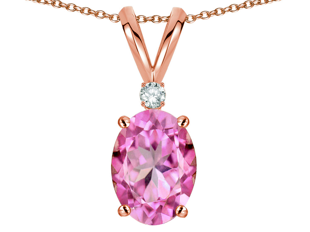 Star K Oval 7x5mm Created Pink Sapphire Classic Rabbit Ears Pendant Necklace
