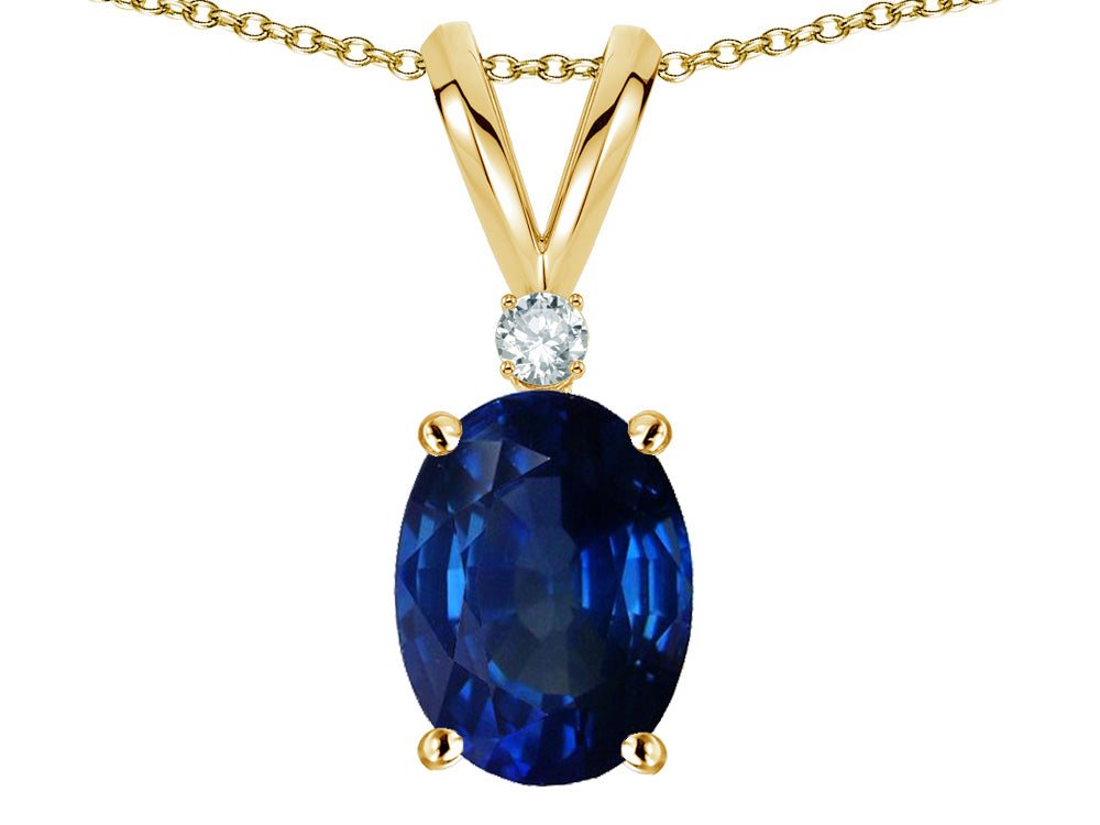 Star K Oval 7x5mm Created Sapphire Classic Rabbit Ears Pendant Necklace