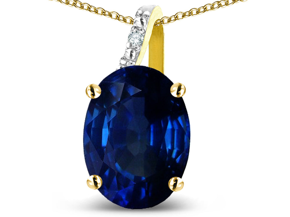 Star K  Oval 9x7 Created Sapphire Journey Pendant Necklace