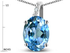 Star K 10k Gold Oval 9x7 Genuine Blue Topaz Journey Pendant Necklace