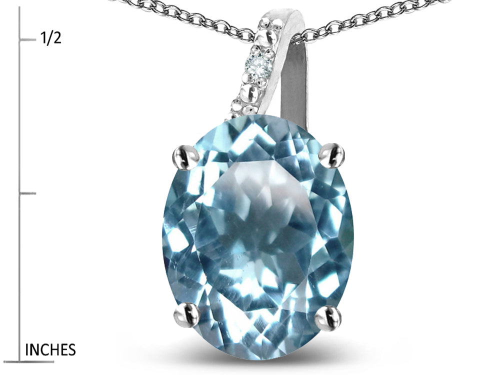 Star K 10k Gold Oval 9x7 Genuine Sky Blue Topaz Journey Pendant Necklace