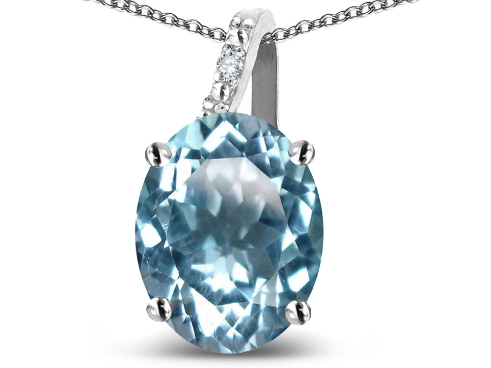 Star K 10k Gold Oval 9x7 Genuine Sky Blue Topaz Journey Pendant Necklace
