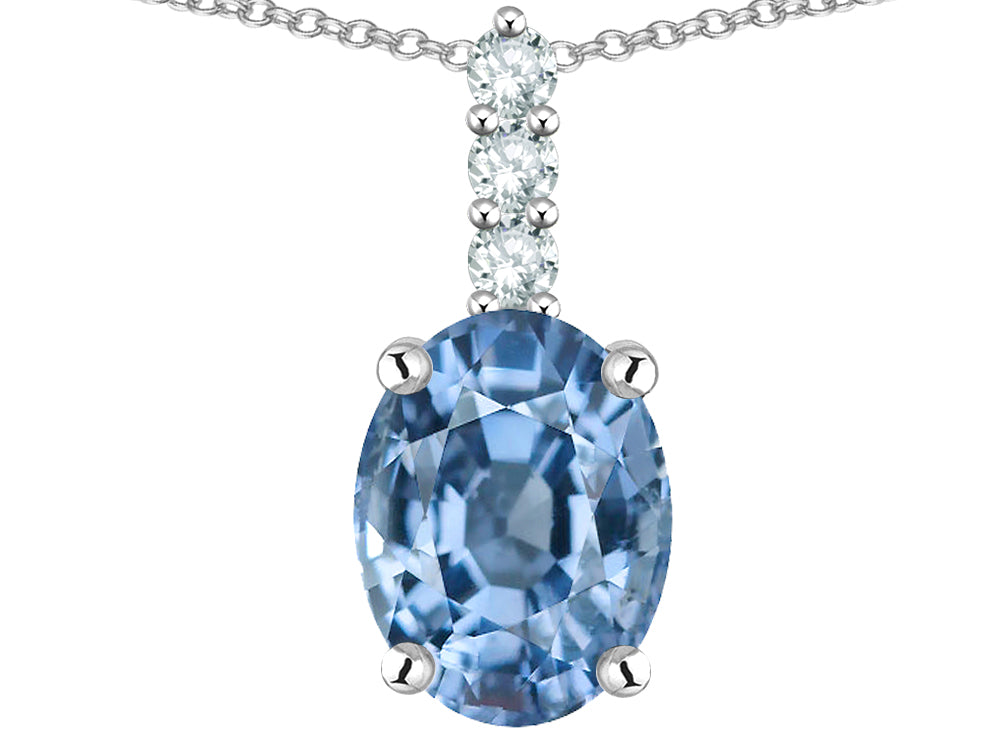 Star K  8x6mm Oval Simulated Aquamarine Three Stone Pendant Necklace