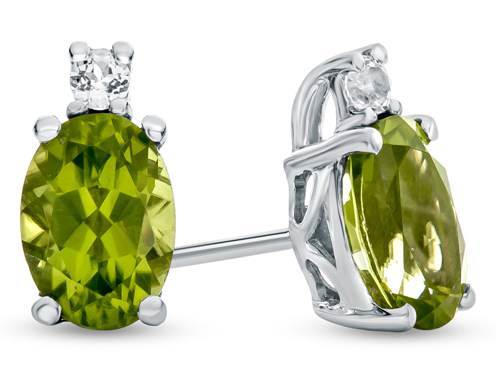 FJC Finejewelers 10k White Gold 7x5mm Oval Peridot with White Topaz Earrings