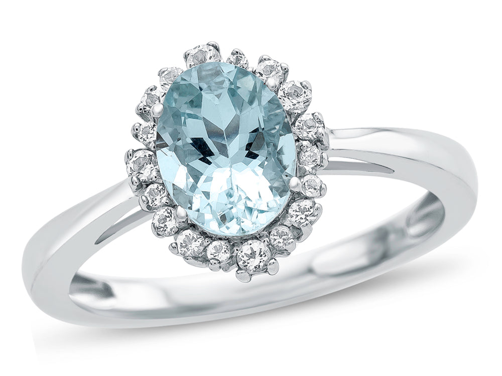 FJC Finejewelers 10k White Gold 8x6mm Oval Aquamarine with White Topaz accent stones Halo Ring