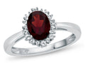 FJC Finejewelers 10k White Gold 8x6mm Oval Garnet with White Topaz accent stones Halo Ring