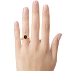 FJC Finejewelers 10k Yellow Gold  8x6mm Oval Garnet with White Topaz accent stones Halo Ring