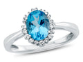 FJC Finejewelers 10k White Gold 8x6mm Oval Swiss Blue Topaz with White Topaz accent stones Halo Ring