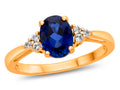 FJC Finejewelers 10k Yellow Gold 8x6mm Oval Created Blue Sapphire and White Topaz Ring