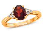FJC Finejewelers 10k Yellow Gold 8x6mm Oval Garnet and White Topaz Ring