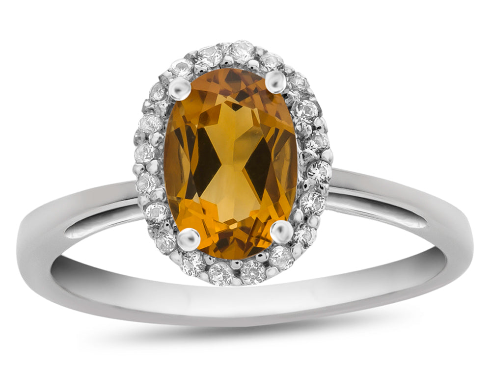 FJC Finejewelers 10k White Gold 7x5mm Oval Citrine with White Topaz accent stones Halo Ring