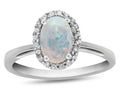 FJC Finejewelers 10k White Gold 7x5mm Oval Created Opal with White Topaz accent stones Halo Ring
