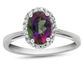 FJC Finejewelers 10k White Gold 7x5mm Oval Mystic Topaz with White Topaz accent stones Halo Ring