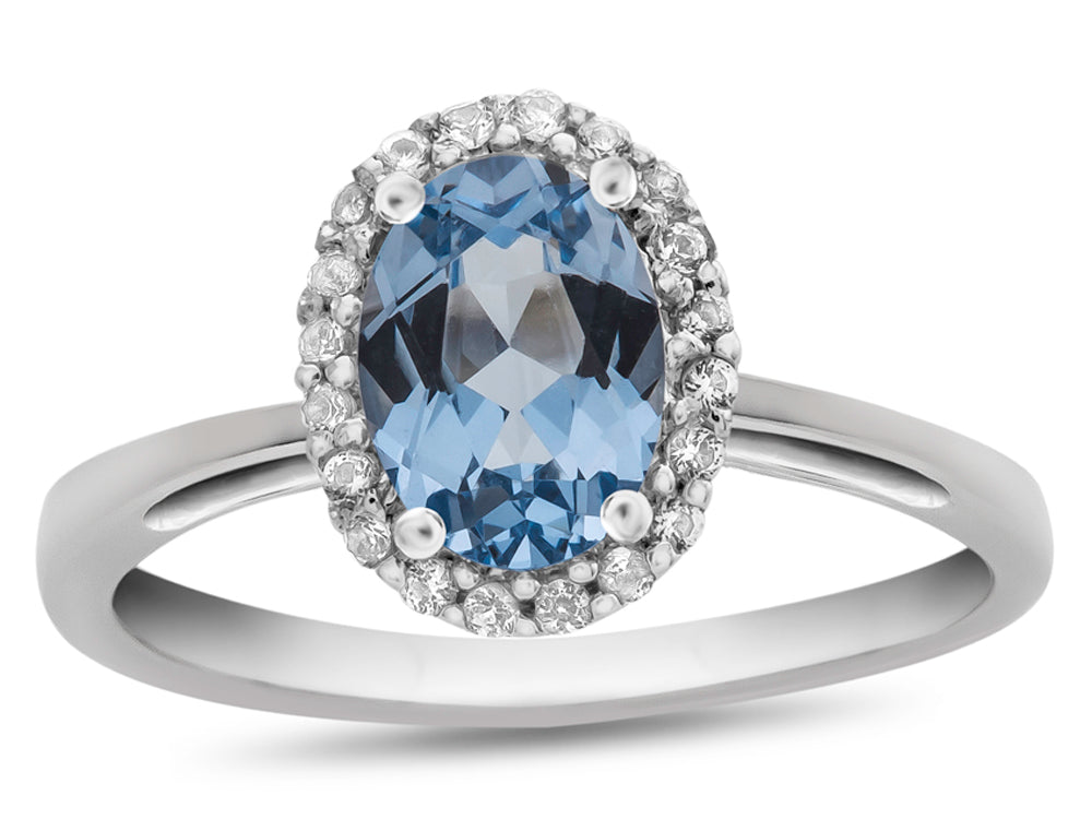 FJC Finejewelers 10k White Gold 7x5mm Oval Simulated Aquamarine with White Topaz accent stones Halo Ring