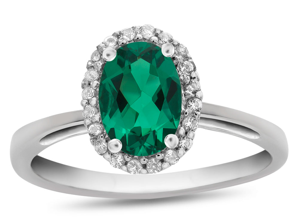 FJC Finejewelers 10k White Gold 7x5mm Oval Simulated Emerald with White Topaz accent stones Halo Ring