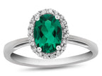 FJC Finejewelers 10k White Gold 7x5mm Oval Simulated Emerald with White Topaz accent stones Halo Ring