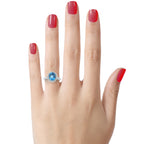 FJC Finejewelers Sterling Silver 3.90 cttw 8x10mm Oval Swiss Blue Topaz and White Topaz side stones Halo Ring